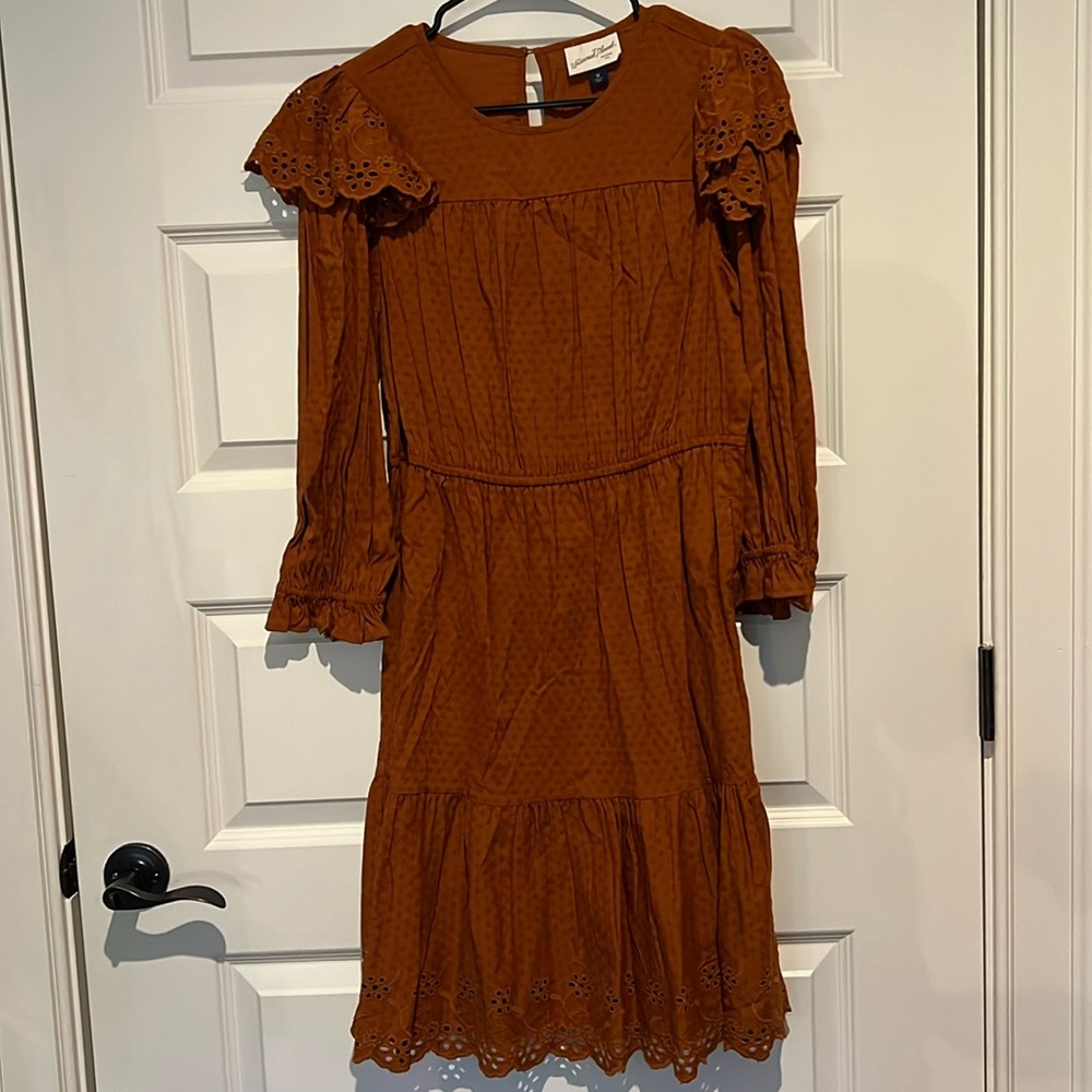 Orange dress w/ large sleeves and decorative flowers